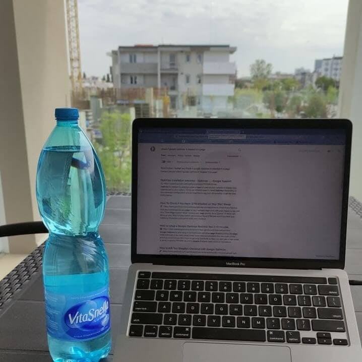 Work Macbook with a background view of a construction site